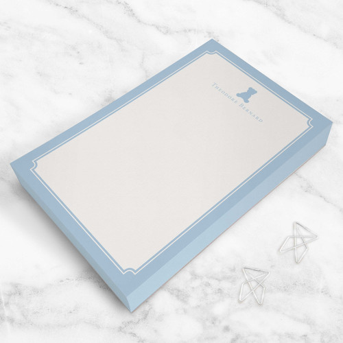 Personalized teddy bear notepad with name printed in sky blue ink, styled on white marble—custom rectangular stationery for kids and moms.